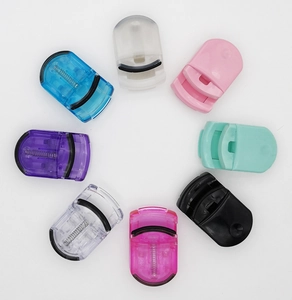 Portable mini plastic eyelash curlers set in multiple vibrant colors for daily makeup use.
