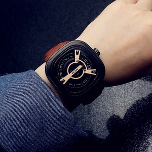 Close-up of a punk square dial watch featuring a brown leather strap and rose gold markers