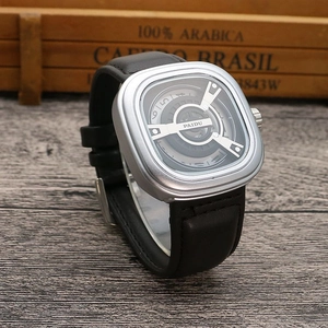 Close-up of square silver quartz watch with unique dial and black leather strap