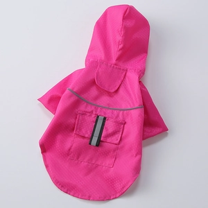 Detail of rose pink dog raincoat featuring honeycomb waterproof fabric and reflective strip