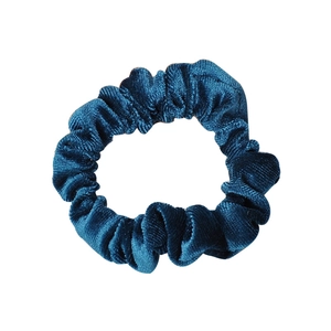 Peacock blue velvet scrunchie hair tie with soft texture on a clean white background