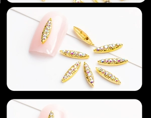 Macro view of golden marquise alloy nail charms with colorful rhinestones for DIY manicure