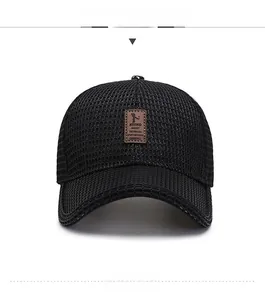 Close-up of black breathable mesh baseball cap with a brown leather logo patch