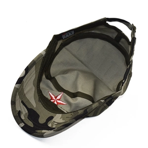 Close-up of camouflage flat top cap showing interior red star embroidery and buckle