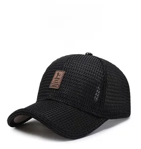 Detail of black mesh baseball cap showing breathable texture and leather logo patch