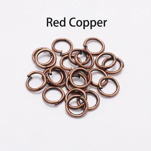 Close-up of red copper open jump rings for DIY jewelry making and necklace connection