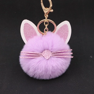 Cute purple plush kitten keychain with glitter ears and whiskers on a gold clasp
