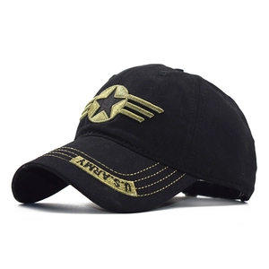 Detail of U.S. ARMY embroidery and olive star patch on black cotton military cap