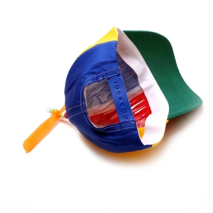 Multi-colored snapback hat with spinning propeller and adjustable strap for kids