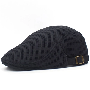 Close-up of black mesh fabric and bronze adjustable buckle on the breathable summer cap