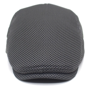 Close-up of breathable dark grey honeycomb mesh fabric on a flat ivy cap for men