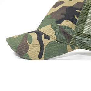 Detail of classic jungle camouflage trucker hat with breathable mesh and sturdy stitching