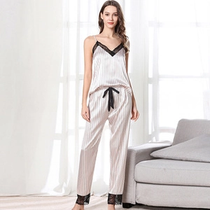 Detailed view of pink striped silk pajama set with black lace trim and bow knot