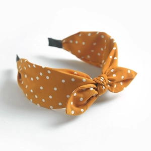 Retro yellow polka dot bow headband with fabric wrap and rabbit ear style