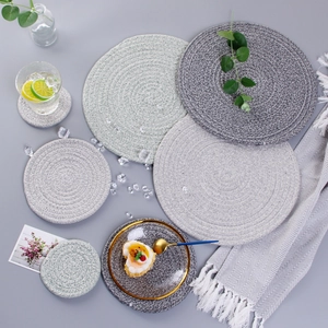 Detail of grey and beige woven cotton rope heat-resistant placemats and coasters