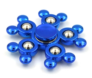Macro shot of blue metallic fidget spinner featuring six arms with steel ball bearings