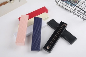 Flat lay of colorful long jewelry boxes with diamond texture for necklaces and bracelets