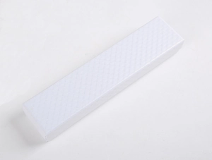 Top view of white long jewelry box with elegant diamond texture for necklaces