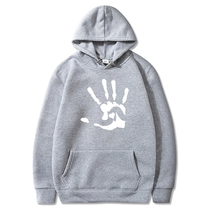 Detail of grey hoodie with white palm print and hood, high-quality fleece cotton texture