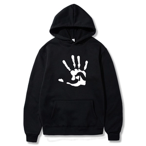 Detailed view of black fleece hoodie featuring a white handprint heart graphic and pocket
