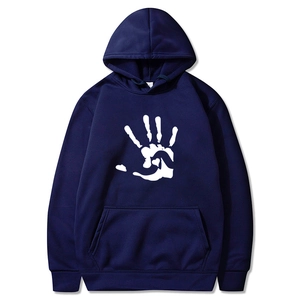 Close-up of white palm print on a navy blue fleece hoodie with drawstring detail