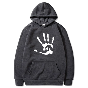 Close-up of a fleece hoodie featuring a palm print and kangaroo pocket detail