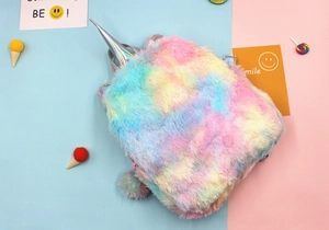 Detailed back view of plush unicorn backpack featuring rainbow faux fur and silver horn