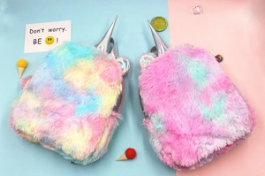 Detail view of colorful plush unicorn backpacks with holographic horns and soft fur texture