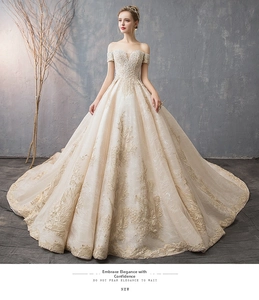 Exquisite champagne off-shoulder wedding gown with intricate floral lace and bead embroidery