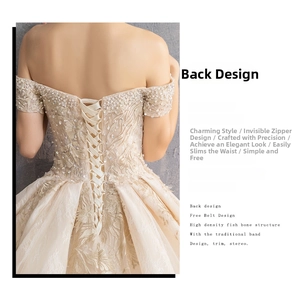 Detailed view of the luxury lace-up back design with champagne sequins and embroidery