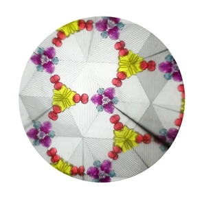 Detailed interior view showing colorful symmetric geometric patterns of a kaleidoscope