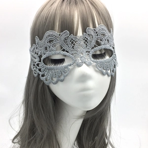 Close-up of silver-gray phoenix lace mask with intricate embroidery for Halloween