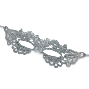 Detailed embroidery texture on a silver lace masquerade eye mask for Halloween parties