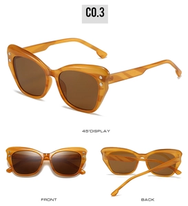 Three perspectives of bright orange cat-eye sunglasses with thick frames and metal rivets