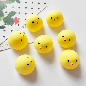 Group of seven yellow chick squeeze toys for stress relief on a clean white background