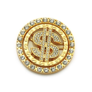 Close-up of a rotating gold maple leaf accessory with dollar sign and shiny rhinestones