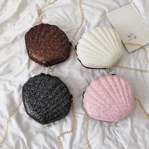 Mini shell crossbody bags in four colors with glitter finish and pearl chain details