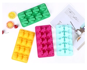Detail showing multi-color tropical shaped silicone ice cube molds in a flat lay view