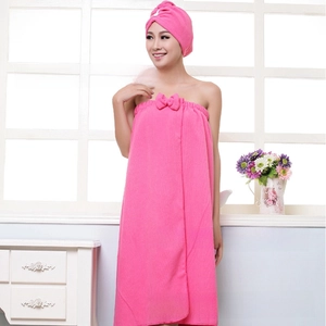 Pink microfiber bath towel set with bow detail and matching hair drying cap for women