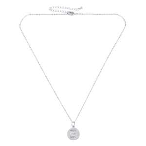 Macro detail of silver round pendant necklace with zircon-encrusted letter E and fine chain