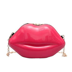 Stylish lip-shaped crossbody bag in glossy rose red patent leather with gold chain