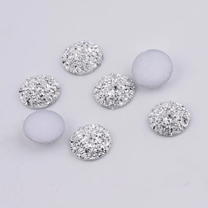 Macro shot of 14mm silver starry resin flatback crystals for DIY jewelry accessories