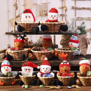 Detailed view of assorted Christmas woven baskets featuring plush Santa, snowman, and reindeer characters.