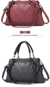 Detail of soft leather tote bags with V-shaped patchwork design in gray and dusty pink
