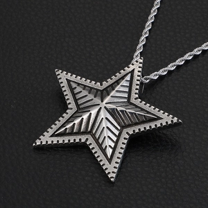 Vintage stainless steel pentagram pendant with geometric textures on a twist chain