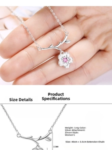 Detail of silver cherry blossom necklace with pink zircon and branch pendant size info