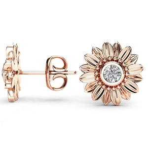 Macro view of 18k gold sunflower earrings with sparkling center cubic zirconia
