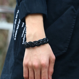 Vintage black braided leather bracelet for men featuring a punk minimalist style