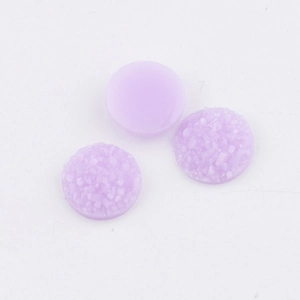 Macro detail of 10mm purple resin druzy cabochons with sparkling crushed ice texture