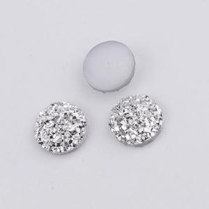 Macro shot of 10mm starry resin druzy cabochons in silver and matte grey for DIY jewelry